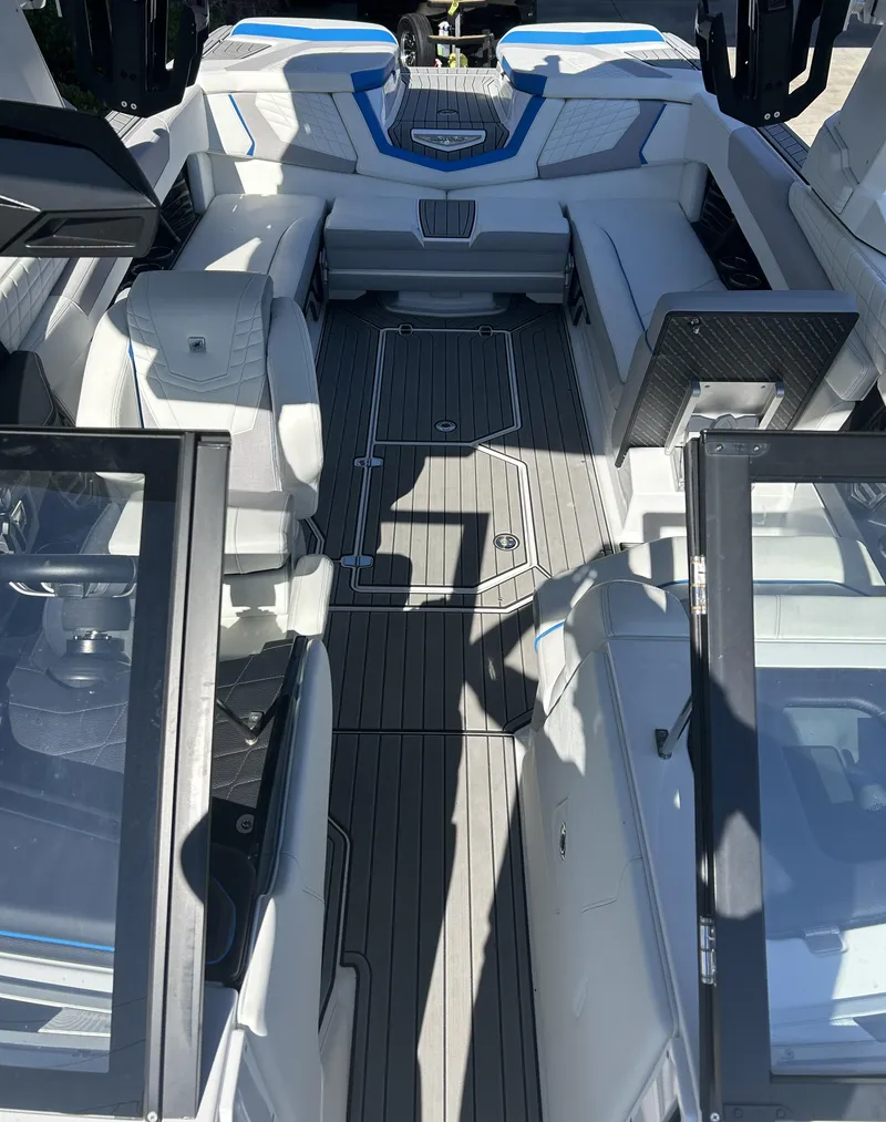 Slide: The Image of 2023 Nautique G25 boat interior with luxurious seating and modern design. - 7