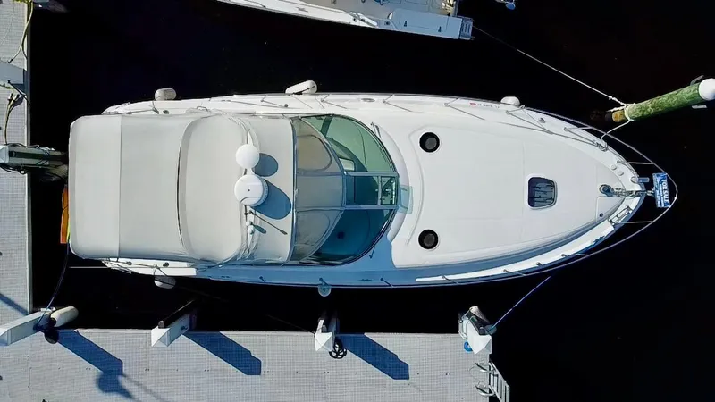 Slide: The Image of Aerial view of a 2006 Sea Ray 340 Sundancer docked at a marina. - 1