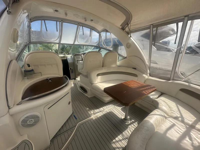Slide: The Image of Interior of a 2006 Sea Ray 340 Sundancer yacht with seating and table. - 29