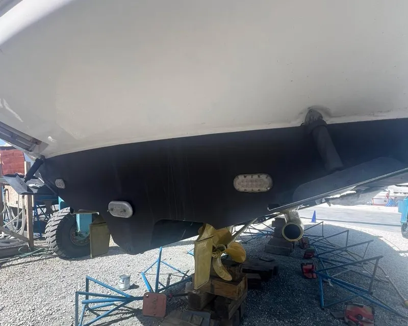 Slide: The Image of 2006 Sea Ray 340 Sundancer boat hull on dry dock for maintenance. - 53