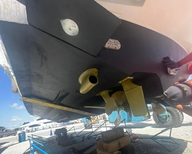 Slide: The Image of 2006 Sea Ray 340 Sundancer boat hull and propeller in dry dock. - 54