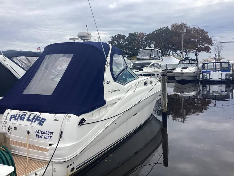 Slide: The Image of 2005 Sea Ray 320 Sundancer docked in marina, Patchogue, New York. - 0