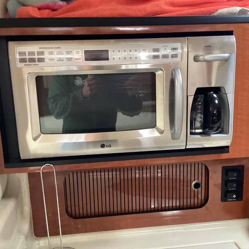 Slide: The Image of LG microwave and coffee maker in 2005 Sea Ray 320 Sundancer yacht kitchen. - 22