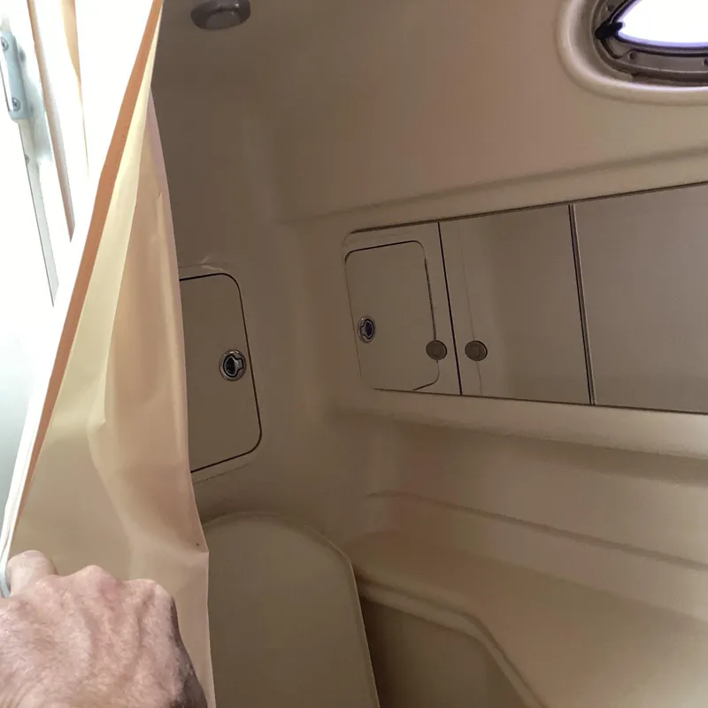 Slide: The Image of Interior cabin of 2005 Sea Ray 320 Sundancer with storage compartments. - 24