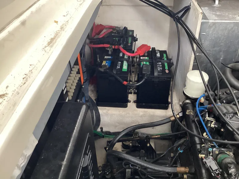 Slide: The Image of Engine compartment of 2005 Sea Ray 320 Sundancer with batteries and wiring. - 29