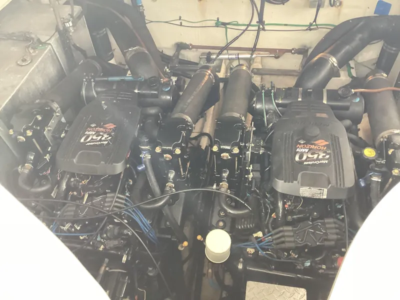 Slide: The Image of Twin engines of a 2005 Sea Ray 320 Sundancer boat. - 30
