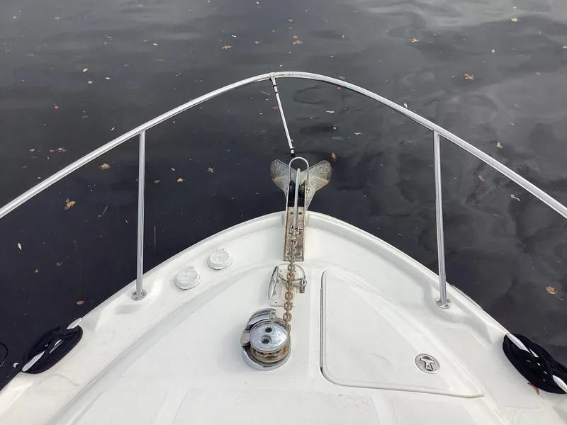 Slide: The Image of Bow of 2005 Sea Ray 320 Sundancer on calm water. - 5