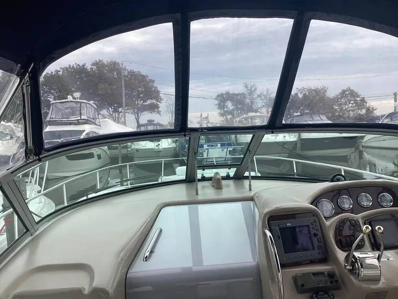 Slide: The Image of Interior view of 2005 Sea Ray 320 Sundancer boat cockpit with navigation controls. - 7