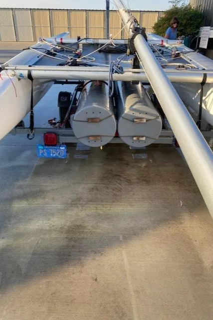 Slide: The Image of 1989 Nacra 5.8 catamaran on trailer, rear view, with visible license plate. - 10