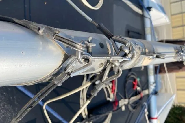 Slide: The Image of Close-up of 1989 Nacra 5.8 sailboat rigging and mast details. - 14
