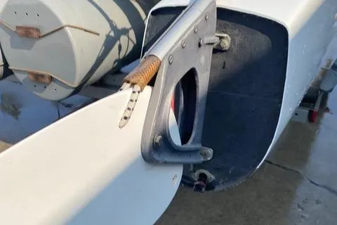 Slide: The Image of Close-up of a 1989 Nacra 5.8 sailboat rudder and tiller mechanism. - 15