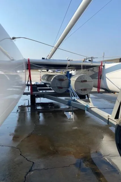 Slide: The Image of 1989 Nacra 5.8 catamaran on trailer, ready for transport. - 16