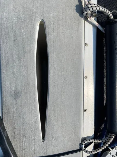 Slide: The Image of Close-up of a 1989 Nacra 5.8 catamaran deck with rigging details. - 4