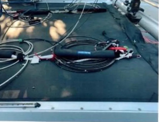 Slide: The Image of 1989 Nacra 5.8 catamaran deck with rigging and equipment. - 9