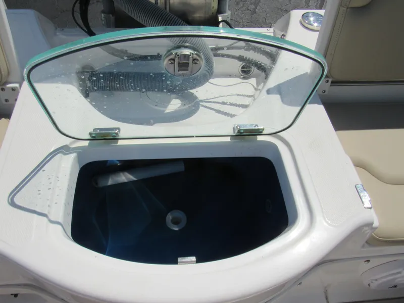 Slide: The Image of Livewell compartment on a 2019 Everglades 243 CC boat with open lid. - 14