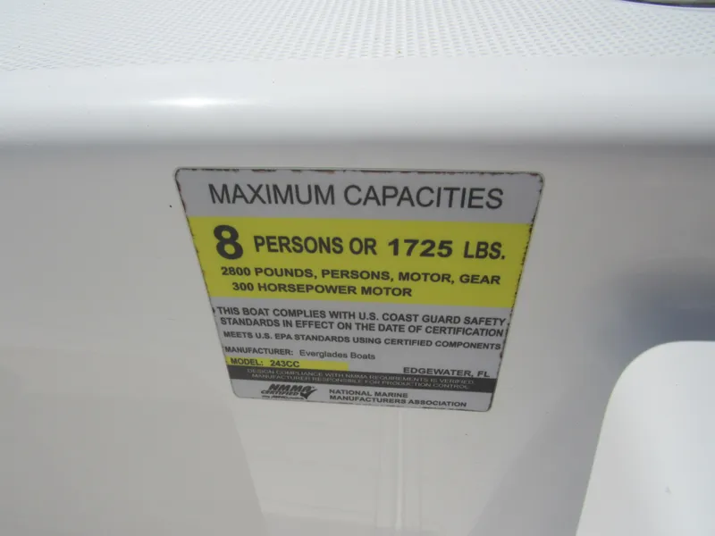 Slide: The Image of 2019 Everglades 243 CC boat capacity label, 8 persons or 1725 lbs, 300 horsepower motor. - 26