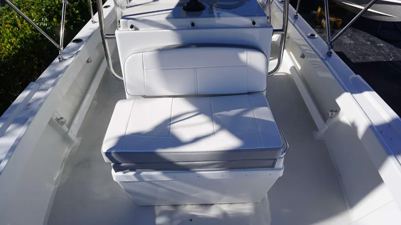 Slide: The Image of 2024 Parker 1801CC boat interior with white seating and console. - 14