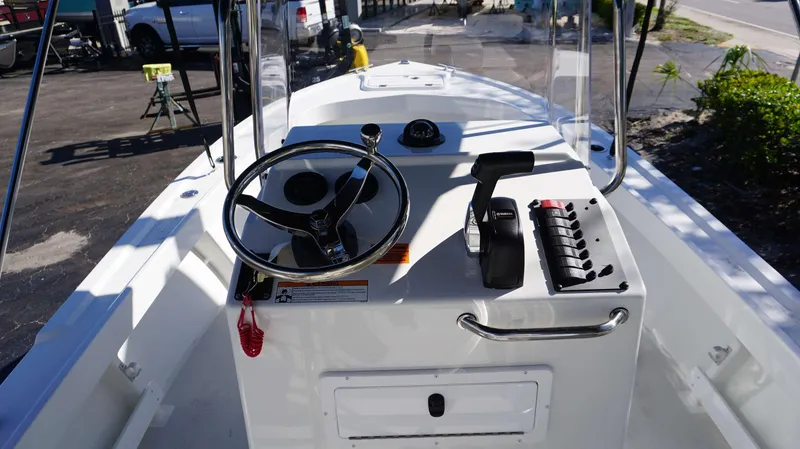 Slide: The Image of 2024 Parker 1801CC boat console with steering wheel and controls. - 6
