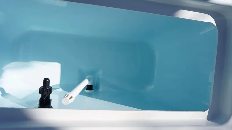 Slide: The Image of 2024 Parker 1801CC boat interior compartment with blue finish and fittings. - 7