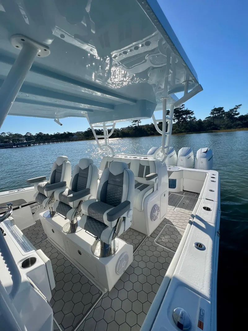 Slide: The Image of 2024 Invincible 43 Open Fisherman boat with luxury seating and advanced controls. - 14