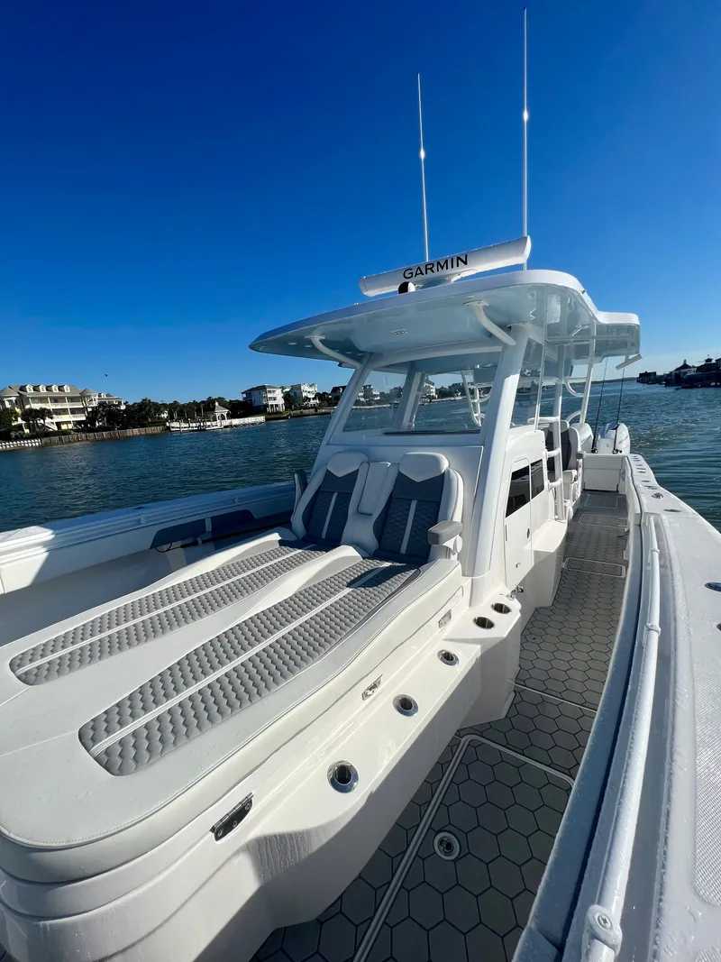 Slide: The Image of 2024 Invincible 43 Open Fisherman boat on calm water. - 27