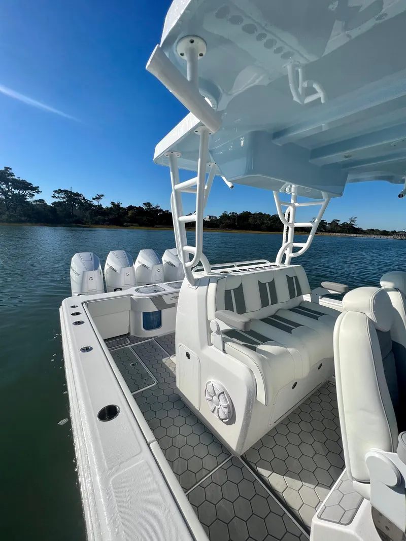 Slide: The Image of 2024 Invincible 43 Open Fisherman boat with luxurious seating and powerful outboard engines. - 17