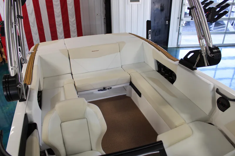 Slide: The Image of 2024 MasterCraft NXT22 boat interior with white seating and modern design. - 19