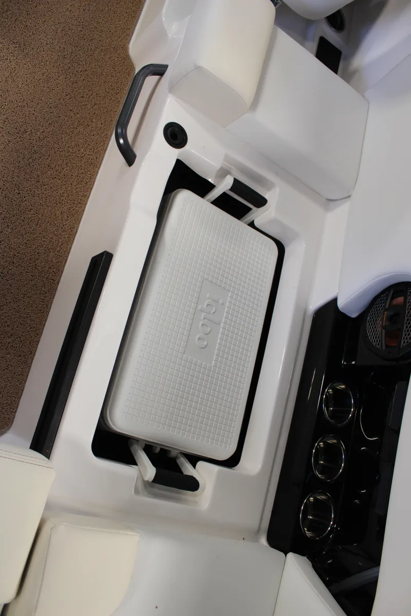 Slide: The Image of 2024 MasterCraft NXT22 boat interior with built-in cooler storage. - 25