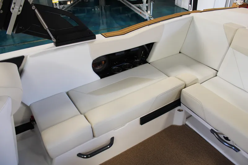 Slide: The Image of 2024 MasterCraft NXT22 boat interior with white leather seating. - 28