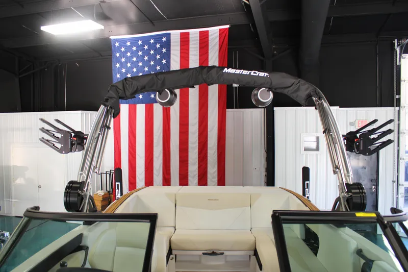Slide: The Image of 2024 MasterCraft NXT22 boat interior with American flag backdrop. - 35