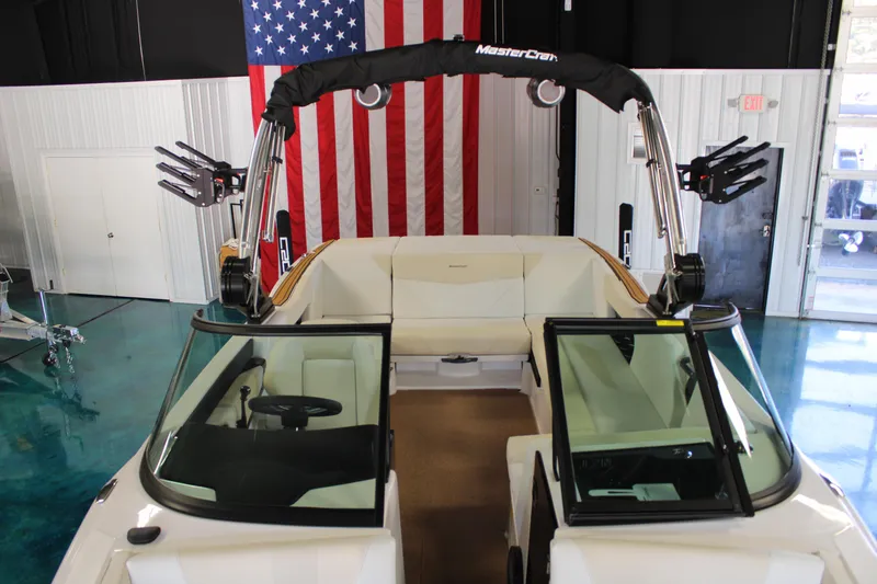 Slide: The Image of 2024 MasterCraft NXT22 boat interior with American flag backdrop. - 5