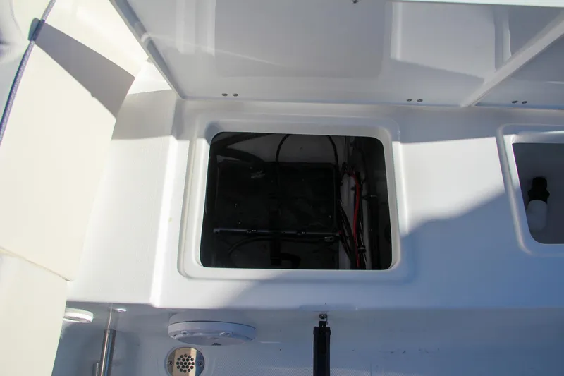 Slide: The Image of 2024 Sea Hunt Ultra 229 boat storage compartment - 17