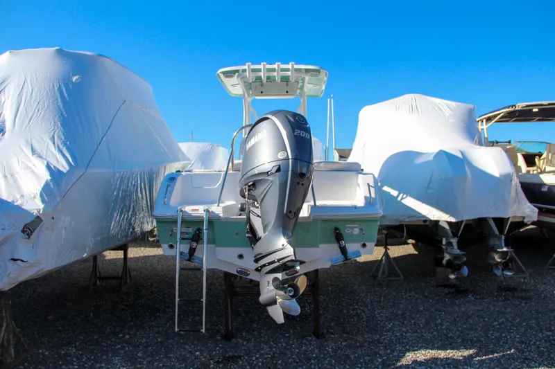 Slide: The Image of 2024 Sea Hunt Ultra 229 boat with Yamaha engine in storage. - 2