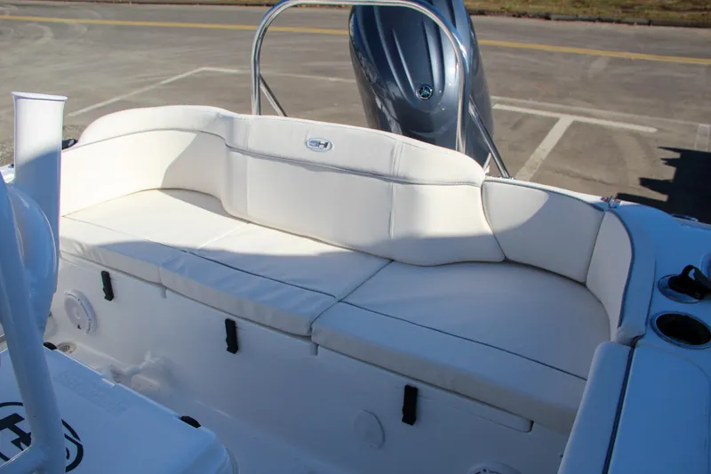Slide: The Image of 2024 Sea Hunt Ultra 229 boat with white cushioned seating. - 26