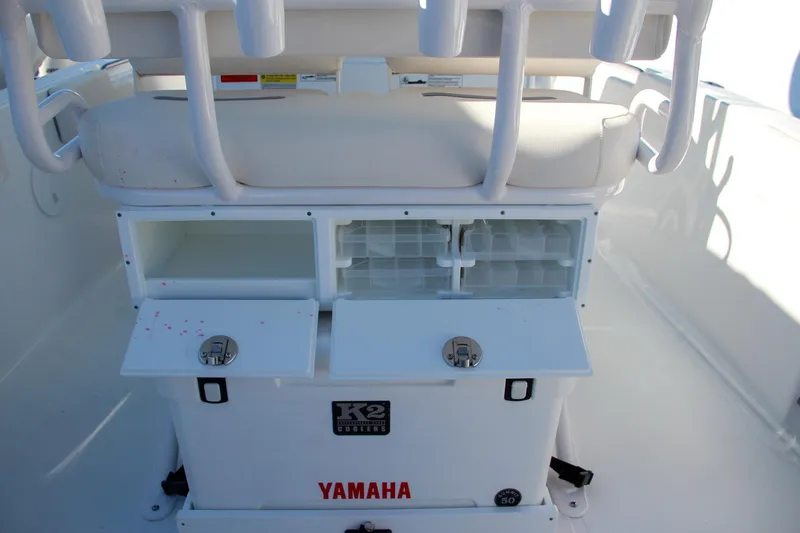 Slide: The Image of 2024 Sea Hunt Ultra 229 boat storage compartments and seating area. - 28