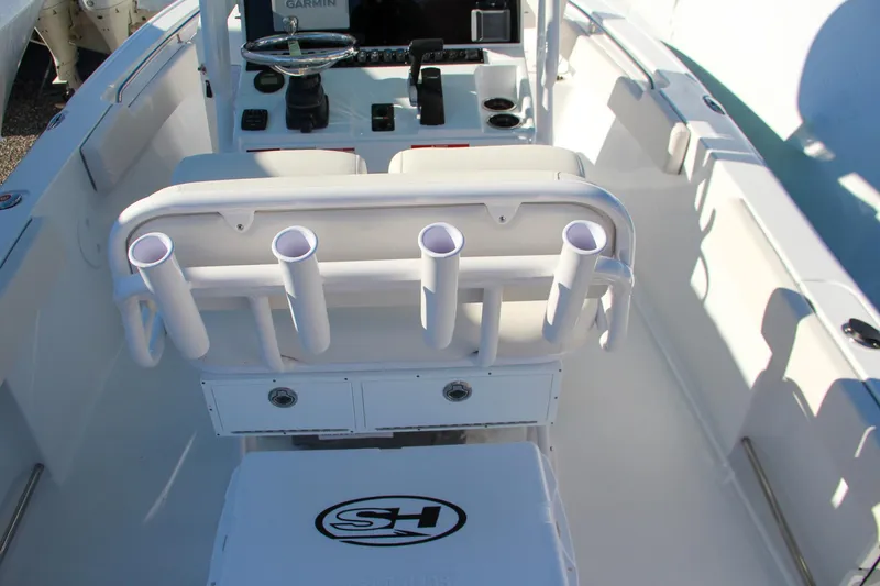 Slide: The Image of 2024 Sea Hunt Ultra 229 boat interior with rod holders and control panel. - 30