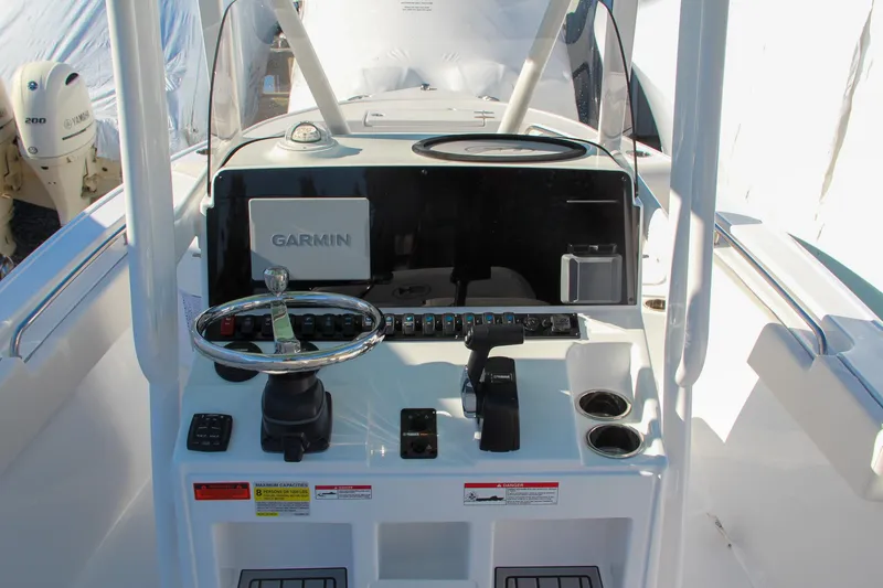 Slide: The Image of 2024 Sea Hunt Ultra 229 boat console with Garmin navigation system. - 32