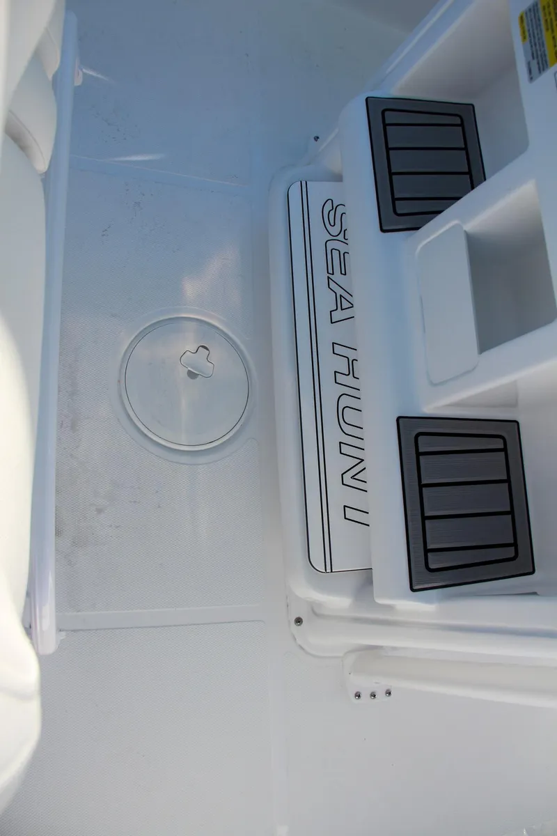 Slide: The Image of 2024 Sea Hunt Ultra 229 boat deck with storage compartments. - 35