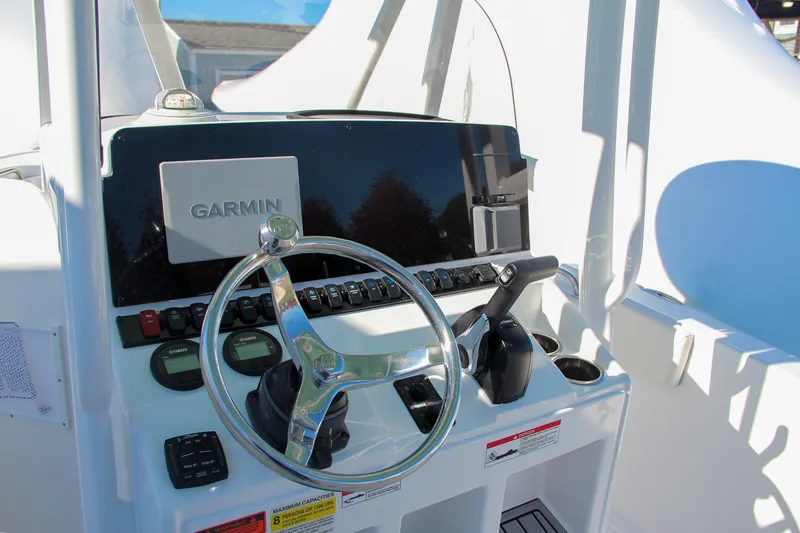 Slide: The Image of 2024 Sea Hunt Ultra 229 boat console with Garmin navigation system. - 37