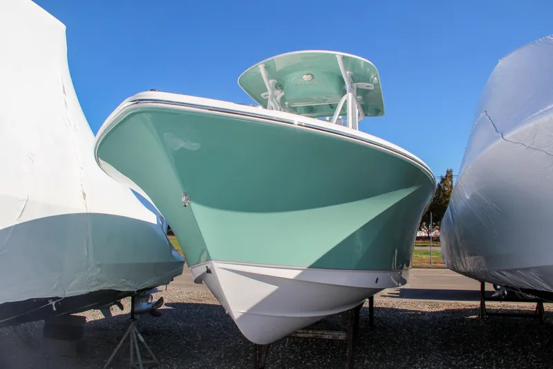 Slide: The Image of 2024 Sea Hunt Ultra 229 boat in storage yard. - 4