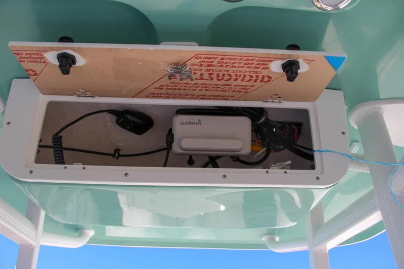 Slide: The Image of 2024 Sea Hunt Ultra 229 electronics compartment with Garmin device. - 44