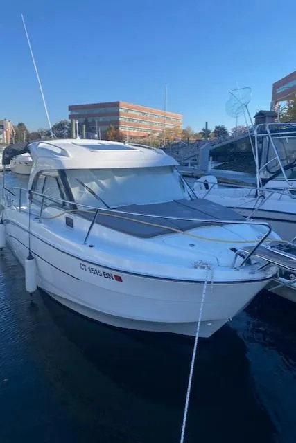 The Image of 2021 Beneteau Antares 23 boat docked in a marina. - 0