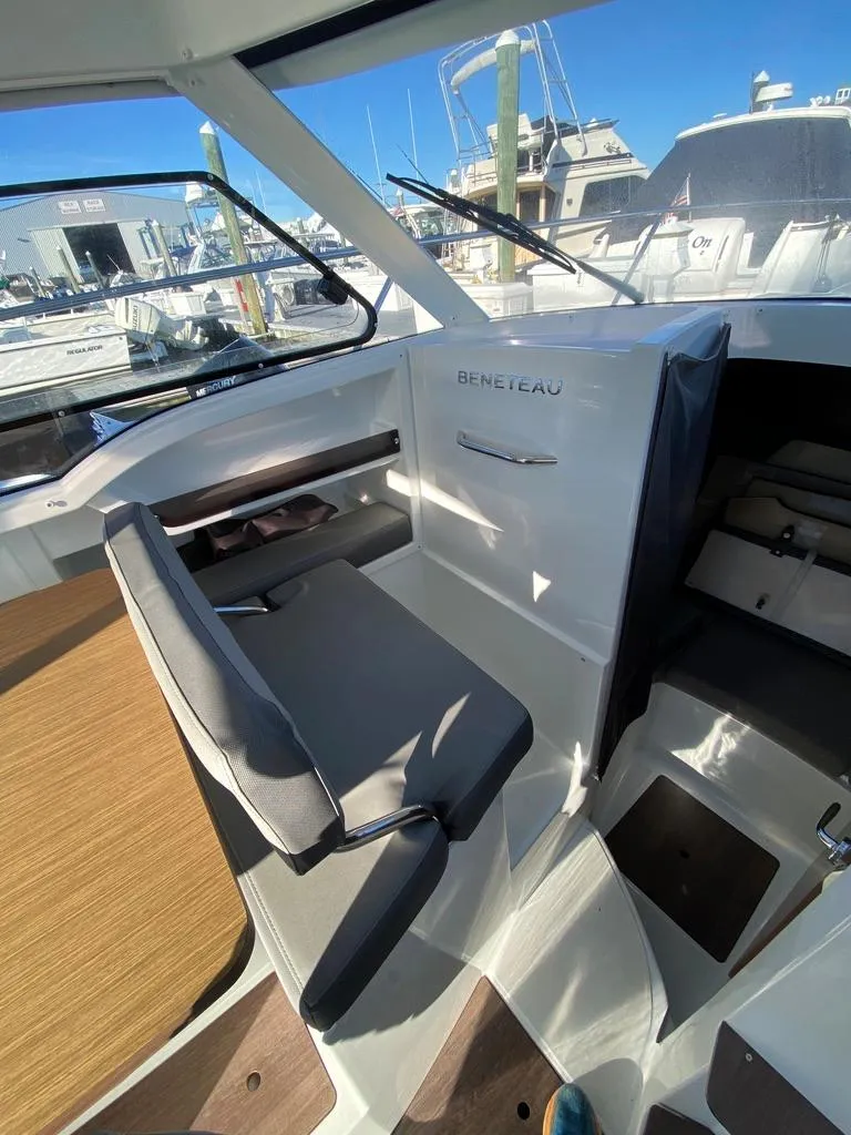 Slide: The Image of Interior of 2021 Beneteau Antares 23 boat with helm seat and dashboard. - 8
