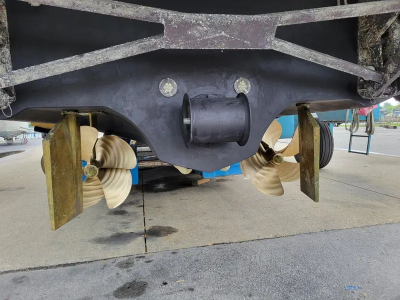 Slide: The Image of 2014 Sunseeker 68 Predator yacht propellers and rudders in dry dock. - 13