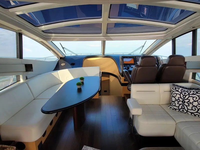 Slide: The Image of Interior of 2014 Sunseeker 68 Predator yacht with luxurious seating and modern helm. - 16