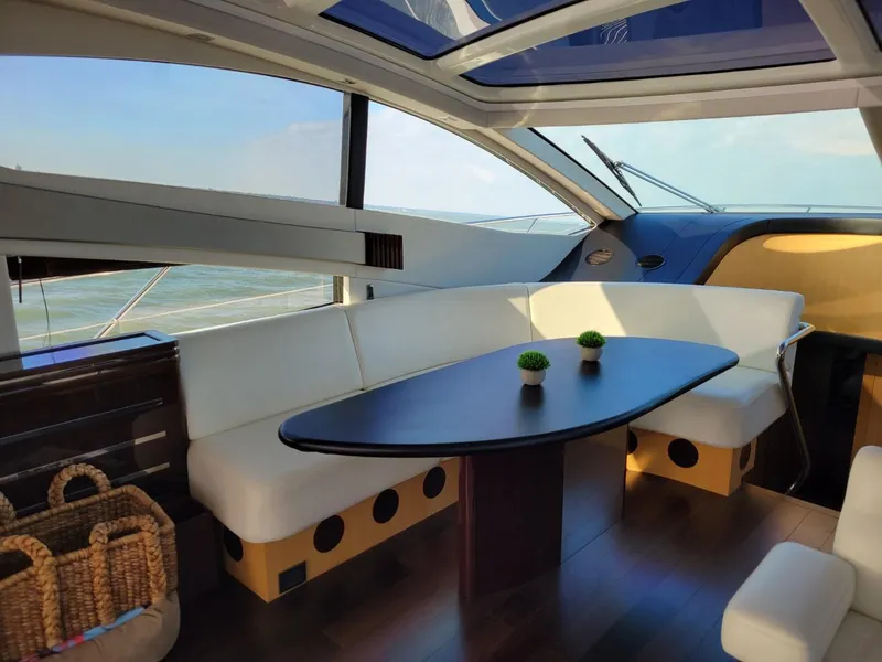 Slide: The Image of Interior of 2014 Sunseeker 68 Predator yacht with modern seating and table. - 17