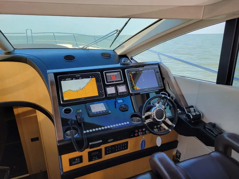 Slide: The Image of Sunseeker 68 Predator 2014 yacht helm with advanced navigation systems. - 2