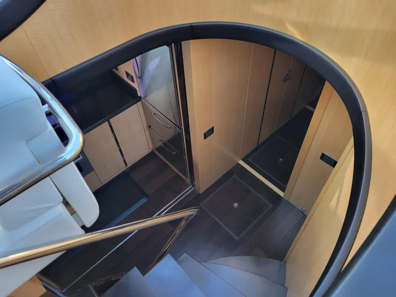 Slide: The Image of Interior stairway of 2014 Sunseeker 68 Predator yacht with modern wood finish. - 21