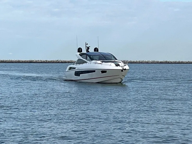 Slide: The Image of 2014 Sunseeker 68 Predator yacht cruising on calm waters. - 29