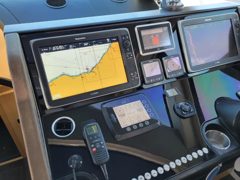 Slide: The Image of Control panel of a 2014 Sunseeker 68 Predator yacht with navigation screens. - 3